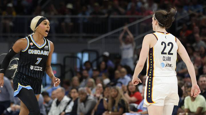 DiJonai Carrington says something to Caitlin Clark during an Indiana Fever vs. Chicago Sky game.