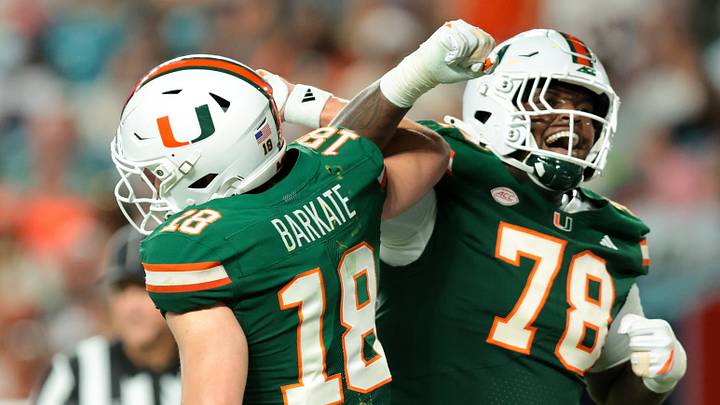 Sep 26, 2026; Miami Gardens, Florida, USA; Miami Hurricanes wide receiver Cooper Barkate (18) celebrates with Miami Hurricanes offensive lineman Matthew McCoy (78) after scoring a touchdown against the Central Michigan Chippewas during the second quarter at Hard Rock Stadium. Mandatory Credit: Sam Navarro-Imagn Images