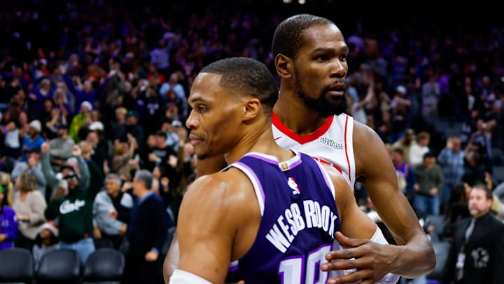 Dec 21, 2025; Sacramento, California, USA; Houston Rockets forward Kevin Durant (7) and Sacramento Kings guard Russell Westbrook (18) hug after the game at Golden 1 Center.
