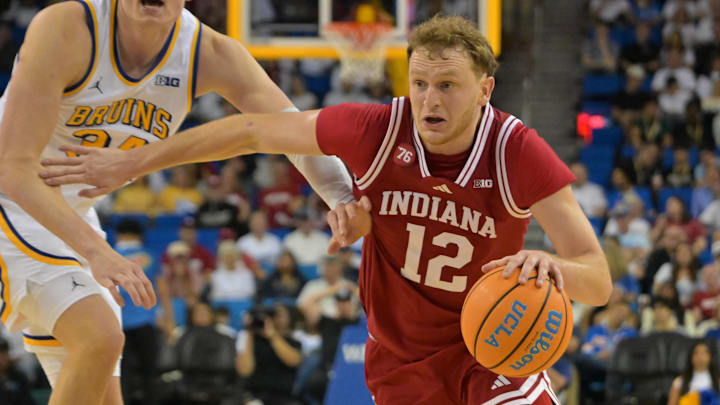Indiana Hoosiers forward Tucker DeVries (12) drives against UCLA  at Pauley Pavilion presented by Wescom Financial.