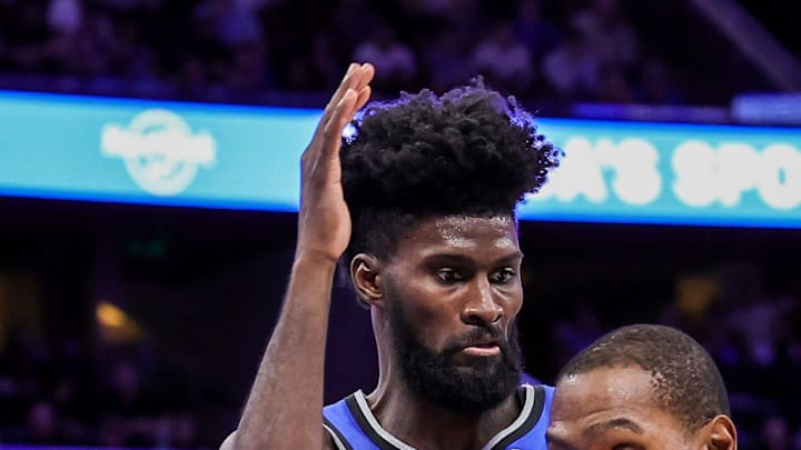 Houston Rockets forward Kevin Durant is fouled by Orlando Magic forward Jonathan Isaac.