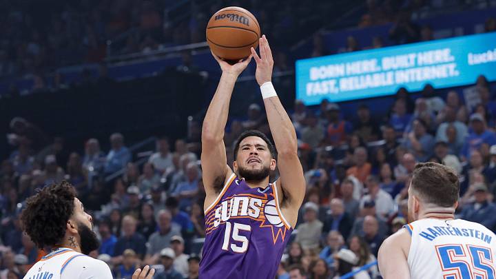 Oct 26, 2026; Oklahoma City, Oklahoma, USA; Phoenix Suns guard Devin Booker (15) shoots against the Oklahoma City Thunder during the first half at Paycom Center. Mandatory Credit: Alonzo Adams-Imagn Images