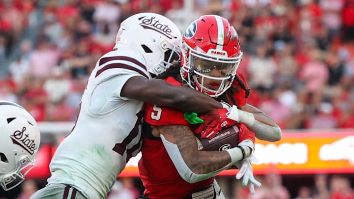 Georgia Bulldogs wide receiver Anthony Evans III (5) runs after a catch against the Mississippi State Bulldogs in the third quarter at Sanford Stadium. 