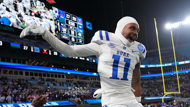 Dec 6, 2025; Charlotte, NC, USA; Duke Blue Devils wide receiver Kavon Simmons (19) and wide receiver Chase Tyler (11) celebrate after winning the ACC Championship game at Bank of America Stadium. Dec 6, 2025; Charlotte, NC, USA; Duke Blue Devils wide receiver Kavon Simmons (19) and wide receiver Chase Tyler (11) celebrate after winning the ACC Championship game at Bank of America Stadium.