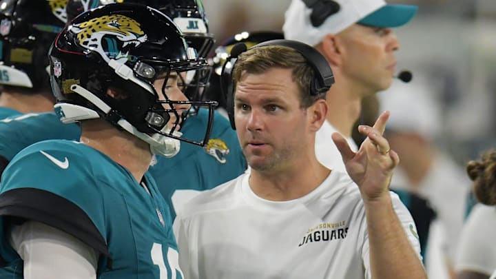 Jaguars offensive coordinator Press Taylor talks with Jacksonville Jaguars quarterback Mac Jones (10) on the sidelines during second half action of Saturday's game against the Chiefs. The Jaguars came away with a 26 to 13 victory over the Kansas City Chiefs. The Jacksonville Jaguars hosted the Kansas City Chiefs in the Jaguars first preseason game of the season Saturday, August 10, 2024 at EverBank Stadium in Jacksonville, Fla. [Bob Self/Florida Times-Union]
