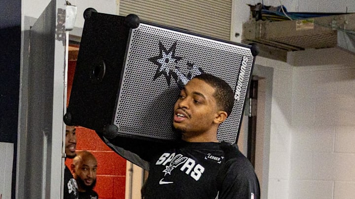 Oct 24, 2025; New Orleans, Louisiana, USA;  San Antonio Spurs forward/guard Keldon Johnson (3) brings out a boombox before entering the arena against the New Orleans Pelicans before  the first half at Smoothie King Center. Mandatory Credit: Stephen Lew-Imagn Images