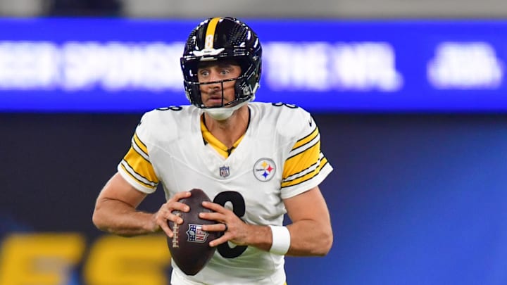 Nov 9, 2025; Inglewood, California, USA; Pittsburgh Steelers quarterback Aaron Rodgers (8) scrambles with the ball against the Los Angeles Chargers during the first quarter of the game at SoFi Stadium. Mandatory Credit: Gary A. Vasquez-Imagn Images