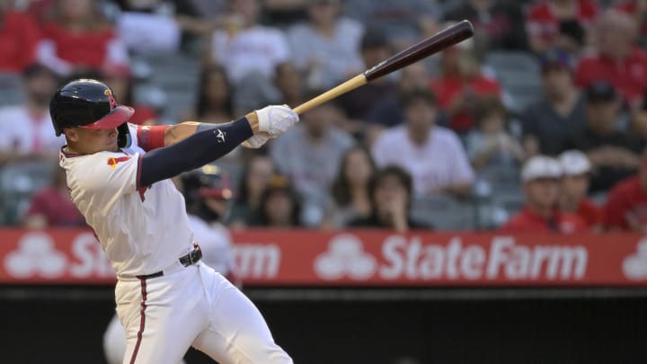 Aug 1, 2024; Anaheim, California, USA;  Los Angeles Angels catcher Logan O'Hoppe (14) hits a two-run home run in the fourth inning against the Colorado Rockies at Angel Stadium. Mandatory Credit: Jayne Kamin-Oncea-USA TODAY Sports