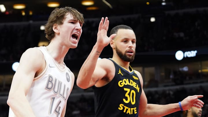 Feb 8, 2025; Chicago, Illinois, USA; Chicago Bulls forward Matas Buzelis (14) reacts after a basket against Golden State Warriors guard Stephen Curry (30) during the second half at United Center. Mandatory Credit: David Banks-Imagn Images