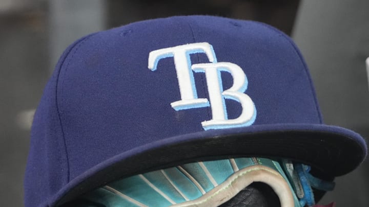 Sep 26, 2025; Toronto, Ontario, CAN; The hat and glove of Tampa Bay Rays third baseman Junior Caminero (13) in the dugout during the game against the Toronto Blue Jays at Rogers Centre. 