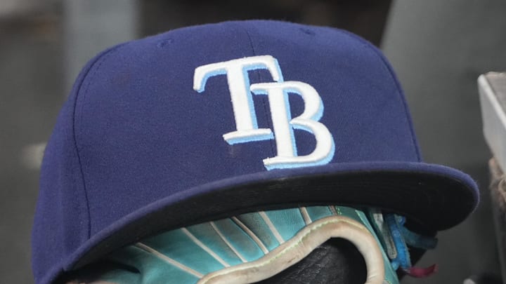 Sep 26, 2025; Toronto, Ontario, CAN; The hat and glove of Tampa Bay Rays third baseman Junior Caminero (13) in the dugout during the game against the Toronto Blue Jays at Rogers Centre. 