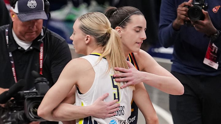 Indiana Fever guard Caitlin Clark (22) and Dallas Wings guard Paige Bueckers (5) hug Sunday, July 13, 2025, ahead of the game at Gainbridge Fieldhouse in Indianapolis.