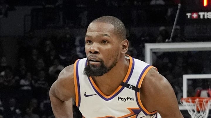 Mar 28, 2025; Minneapolis, Minnesota, USA; Phoenix Suns forward Kevin Durant (35) brings the ball up as Minnesota Timberwolves guard Anthony Edwards (5) defends him in the fourth quarter at Target Center. Mandatory Credit: Bruce Kluckhohn-Imagn Images