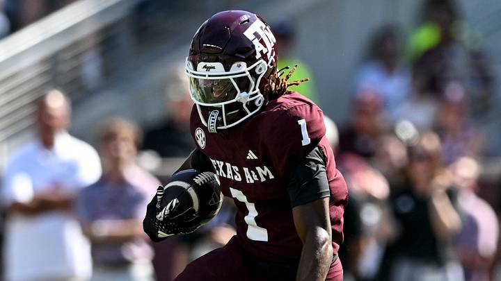 Texas A&M Aggies wide receiver Mario Craver (1) runs the ball during the first half against the Auburn Tigers at Kyle Field. 
