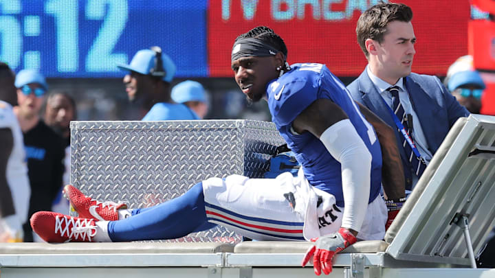 Sep 28, 2025; East Rutherford, New Jersey, USA; New York Giants wide receiver Malik Nabers (1) is carted off the field following an injury during the second quarter against the Los Angeles Chargers at MetLife Stadium.  