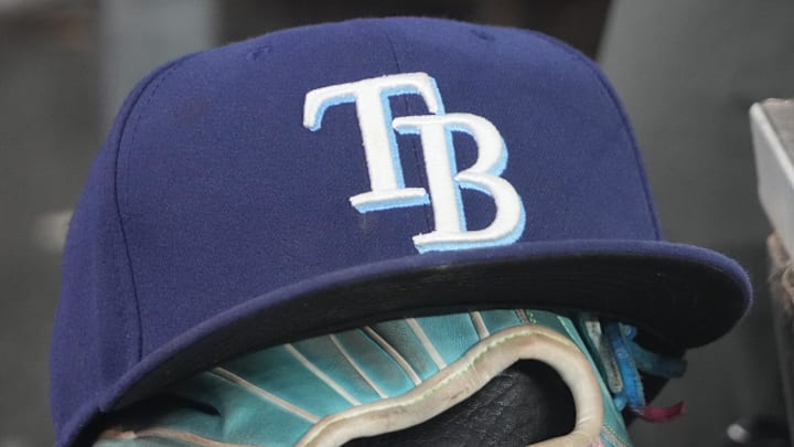Sep 26, 2025; Toronto, Ontario, CAN; The hat and glove of Tampa Bay Rays third baseman Junior Caminero (13) in the dugout during the game against the Toronto Blue Jays at Rogers Centre. Sep 26, 2025; Toronto, Ontario, CAN; The hat and glove of Tampa Bay Rays third baseman Junior Caminero (13) in the dugout during the game against the Toronto Blue Jays at Rogers Centre.