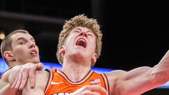 Nov 28, 2024; Kansas City, Missouri, USA; Illinois Fighting Illini guard Kasparas Jakucionis (32) drives to the basket during the second half against the Arkansas Razorbacks at T-Mobile Center. Mandatory Credit: William Purnell-Imagn Images