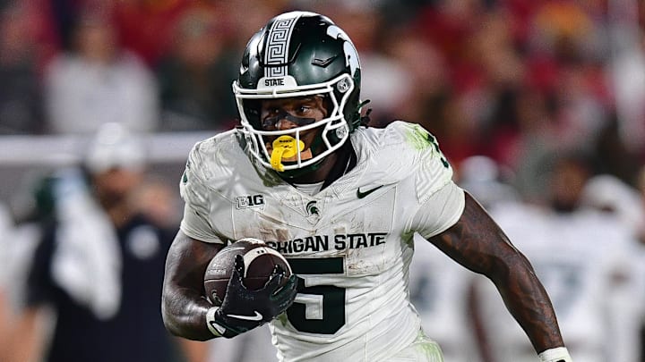 Sep 20, 2025; Los Angeles, California, USA; Michigan State Spartans running back Makhi Frazier (5) runs the ball against the Southern California Trojans during the second half at the Los Angeles Memorial Coliseum. Mandatory Credit: Gary A. Vasquez-Imagn Images