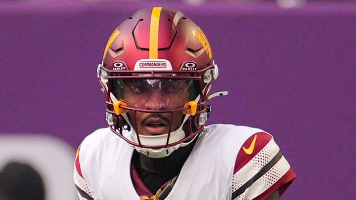 Dec 7, 2025; Minneapolis, Minnesota, USA; Washington Commanders quarterback Jayden Daniels (5) drops back to pass against the Minnesota Vikings during the first half at U.S. Bank Stadium. Mandatory Credit: Brad Rempel-Imagn Images