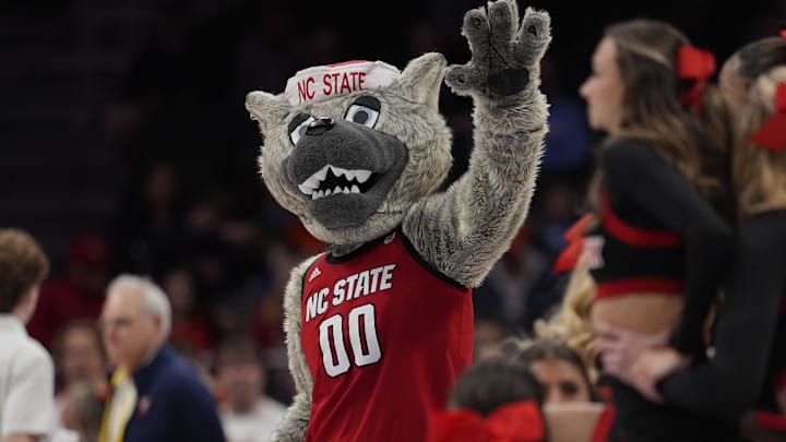 Mar 12, 2026; Charlotte, NC, USA; NC State Wolfpack mascot Mr. Wuf during the first half against the Virginia Cavaliers at Spectrum Center. Mandatory Credit: Jim Dedmon-Imagn Images