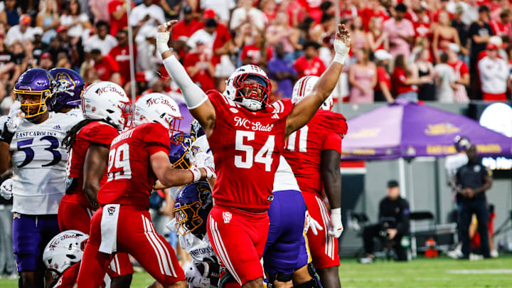 Aug 28, 2025; Raleigh, North Carolina, USA; North Carolina State Wolfpack defensive end Sabastian Harsh (54) celebrates a sack during the first half of the game against East Carolina Pirates at Carter-Finley Stadium. Mandatory Credit: Jaylynn Nash-Imagn Images Aug 28, 2025; Raleigh, North Carolina, USA; North Carolina State Wolfpack defensive end Sabastian Harsh (54) celebrates a sack during the first half of the game against East Carolina Pirates at Carter-Finley Stadium. Mandatory Credit: Jaylynn Nash-Imagn Images