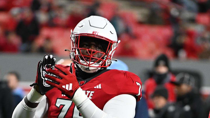 Nov 25, 2023; Raleigh, North Carolina, USA; North Carolina State Wolfpack offensive lineman Anthony Carter Jr. (75) warms up prior to a game against the North Carolina Tar Heels at Carter-Finley Stadium. Mandatory Credit: Rob Kinnan-Imagn Images Nov 25, 2023; Raleigh, North Carolina, USA; North Carolina State Wolfpack offensive lineman Anthony Carter Jr. (75) warms up prior to a game against the North Carolina Tar Heels at Carter-Finley Stadium. Mandatory Credit: Rob Kinnan-Imagn Images