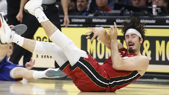 Mar 8, 2026; Miami, Florida, USA;  Miami Heat forward Jaime Jaquez Jr. (11) passes the ball in front of Detroit Pistons guard Kevin Huerter (27) during the first half at Kaseya Center. Mandatory Credit: Rhona Wise-Imagn Images