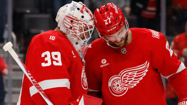 Nov 13, 2025; Detroit, Michigan, USA;  Detroit Red Wings goaltender Cam Talbot (39) and center Michael Rasmussen (27) celebrate after defeating the Anaheim Ducks at Little Caesars Arena. Mandatory Credit: Rick Osentoski-Imagn Images