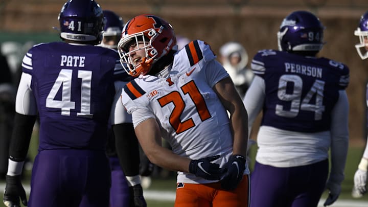 Nov 30, 2024; Chicago, Illinois, USA;  Illinois Fighting Illini running back Aidan Laughery (21) celebrates after scoring a touchdown against the Northwestern Wildcats during the second half at Wrigley Field. Mandatory Credit: Matt Marton-Imagn Images