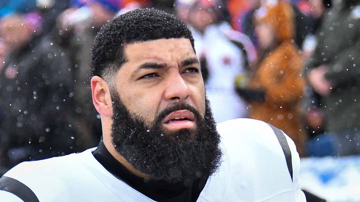 Dec 7, 2025; Orchard Park, New York, USA; Cincinnati Bengals guard Cody Ford (61) on the sidelines before a game against the Buffalo Bills at Highmark Stadium. Mandatory Credit: Mark Konezny-Imagn Images