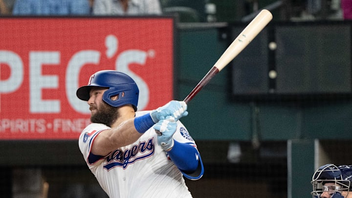Texas Rangers first baseman Jake Burger follows through on a swing.