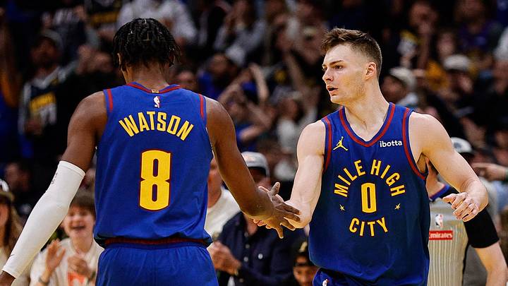 Nov 22, 2024; Denver, Colorado, USA; Denver Nuggets guard Christian Braun (0) reacts with forward Peyton Watson (8) after a play in the third quarter against the Dallas Mavericks at Ball Arena. Nov 22, 2024; Denver, Colorado, USA; Denver Nuggets guard Christian Braun (0) reacts with forward Peyton Watson (8) after a play in the third quarter against the Dallas Mavericks at Ball Arena.