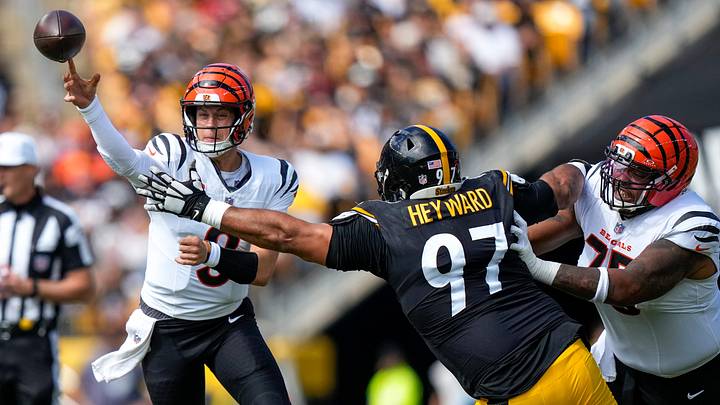 Cincinnati Bengals quarterback Joe Burrow (9) throws with pressure from Pittsburgh Steelers defensive tackle Cameron Heyward (97) in the first quarter of the NFL Week 3 game between the Pittsburgh Steelers and the Cincinnati Bengals at Acrisure Stadium in Pittsburgh on Sunday, Sept. 27, 2026. The game was tied at 17 at halftime. Cincinnati Bengals quarterback Joe Burrow (9) throws with pressure from Pittsburgh Steelers defensive tackle Cameron Heyward (97) in the first quarter of the NFL Week 3 game between the Pittsburgh Steelers and the Cincinnati Bengals at Acrisure Stadium in Pittsburgh on Sunday, Sept. 27, 2026. The game was tied at 17 at halftime.