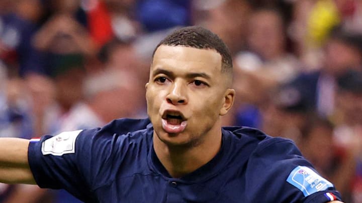 Dec 18, 2022; Lusail, Qatar; France forward Kylian Mbappe (10) celebrates after scoring a goal against Argentina on a penalty kick for his third goal of the match during extra time of the 2022 World Cup final at Lusail Stadium. Mandatory Credit: Yukihito Taguchi-Imagn Images