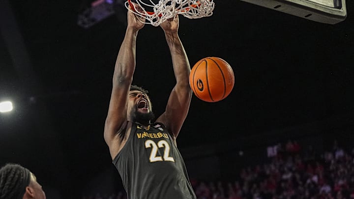 Vanderbilt Commodores forward Jaylen Carey (22) reacts as he dunks the ball next to Georgia Bulldogs guard Silas Demary Jr. (5) during the second half at Stegeman Coliseum. Vanderbilt Commodores forward Jaylen Carey (22) reacts as he dunks the ball next to Georgia Bulldogs guard Silas Demary Jr. (5) during the second half at Stegeman Coliseum.