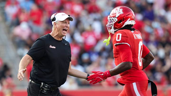 Nov 22, 2025; Houston, Texas, USA; Houston Cougars head coach Willie Fritz celebrates with wide receiver Amare Thomas (0) after Thomas scores a touchdown during the second quarter against the TCU Horned Frogs at TDECU Stadium. Mandatory Credit: Troy Taormina-Imagn Images Nov 22, 2025; Houston, Texas, USA; Houston Cougars head coach Willie Fritz celebrates with wide receiver Amare Thomas (0) after Thomas scores a touchdown during the second quarter against the TCU Horned Frogs at TDECU Stadium. Mandatory Credit: Troy Taormina-Imagn Images
