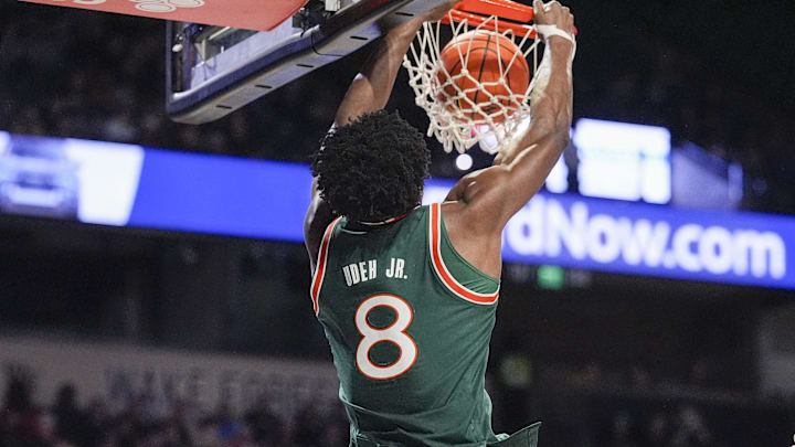 Jan 7, 2026; Winston-Salem, North Carolina, USA; Miami (FL) Hurricanes center Ernest Udeh Jr. (8) dunks the ball watched by Wake Forest Demon Deacons forward Cooper Schwieger (13)during the second half at Lawrence Joel Veterans Memorial Coliseum. Mandatory Credit: Jim Dedmon-Imagn Images Jan 7, 2026; Winston-Salem, North Carolina, USA; Miami (FL) Hurricanes center Ernest Udeh Jr. (8) dunks the ball watched by Wake Forest Demon Deacons forward Cooper Schwieger (13)during the second half at Lawrence Joel Veterans Memorial Coliseum. Mandatory Credit: Jim Dedmon-Imagn Images
