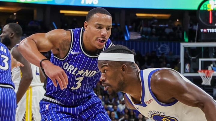 Golden State Warriors forward Jimmy Butler III drives around Orlando Magic guard Desmond Bane. Golden State Warriors forward Jimmy Butler III drives around Orlando Magic guard Desmond Bane.