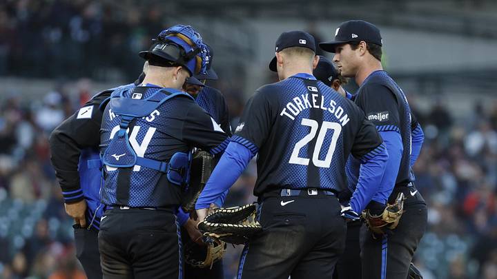 The Detroit Tigers huddle on the mound during a game. The Detroit Tigers huddle on the mound during a game.