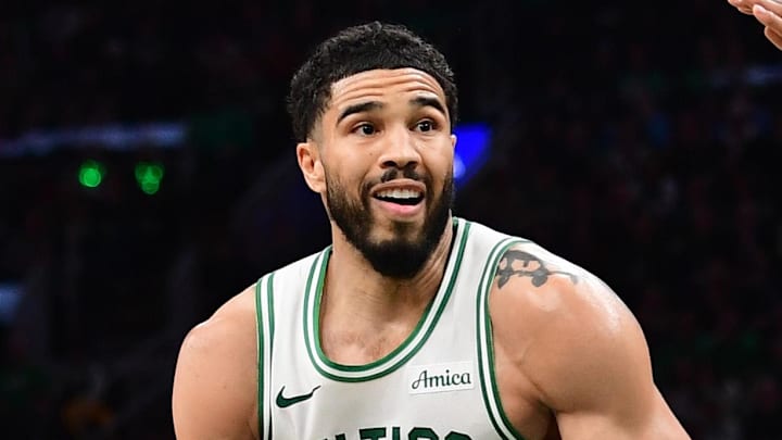 Mar 27, 2026; Boston, Massachusetts, USA; Boston Celtics forward Jayson Tatum (0) drives against Atlanta Hawks guard Nickeil Alexander-Walker (7) during the second half at TD Garden. Mandatory Credit: Bob DeChiara-Imagn Images