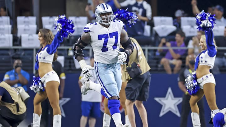 Sep 27, 2021; Arlington, Texas, USA;  Dallas Cowboys offensive tackle Tyron Smith (77) runs onto the