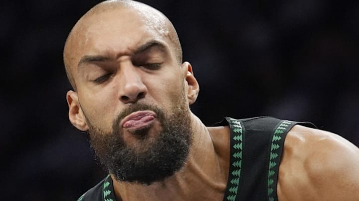 Mar 25, 2026; Minneapolis, Minnesota, USA; Minnesota Timberwolves center Rudy Gobert (27) keeps the ball from a defender from the Houston Rockets in the first quarter at Target Center. Mandatory Credit: Bruce Kluckhohn-Imagn Images