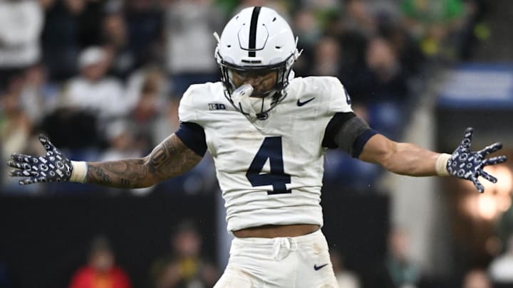 Dec 7, 2024; Indianapolis, IN, USA; Penn State Nittany Lions cornerback A.J. Harris (4) reacts after a tackle against the Oregon Ducks during the fourth quarter in the 2024 Big Ten Championship game at Lucas Oil Stadium. Mandatory Credit: Robert Goddin-Imagn Images