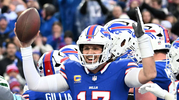 Buffalo Bills quarterback Josh Allen celebrates scoring a rushing touchdown.