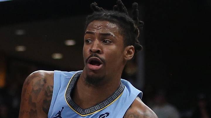 Memphis Grizzlies guard Ja Morant passes the ball as Atlanta Hawks center Christian Koloko defends. Memphis Grizzlies guard Ja Morant passes the ball as Atlanta Hawks center Christian Koloko defends.