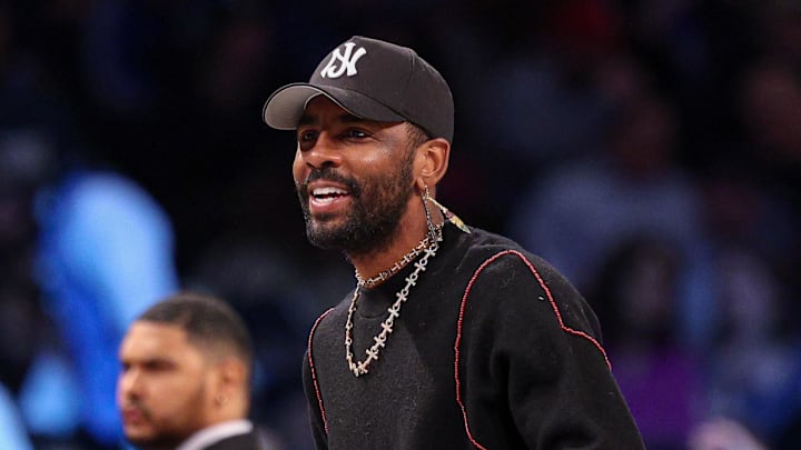 Dallas Mavericks guard Kyrie Irving looks on during the first quarter against the Brooklyn Nets. Dallas Mavericks guard Kyrie Irving looks on during the first quarter against the Brooklyn Nets.