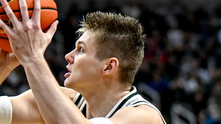 Michigan State's Jaxon Kohler, right, scores as Maryland's Solomon Washington defends during the first half on Saturday, Jan. 24, 2026, at the Breslin Center in East Lansing.