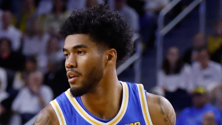 Feb 14, 2026; Ann Arbor, Michigan, USA;  UCLA Bruins guard Donovan Dent (2) dribbles against the Michigan Wolverines at Crisler Center. Mandatory Credit: Rick Osentoski-Imagn Images