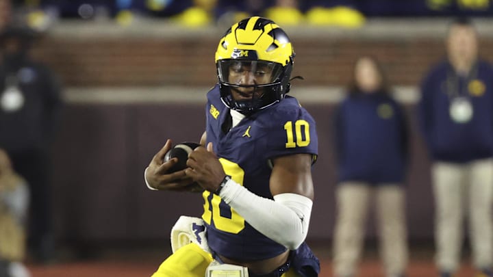 Oct 26, 2024; Ann Arbor, Michigan, USA;  Michigan Wolverines quarterback Alex Orji (10) rushes in the second half against the Michigan State Spartans at Michigan Stadium. Mandatory Credit: Rick Osentoski-Imagn Images