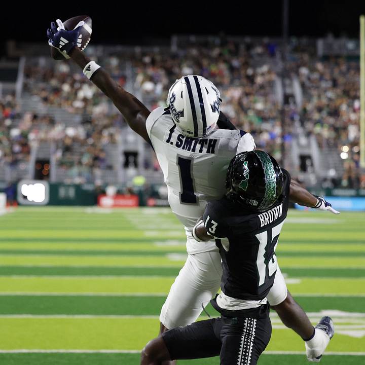 Hawaii Rainbow Warriors defensive back Caleb Brown and Nevada Wolf Pack wide receiver Jaden Smith.